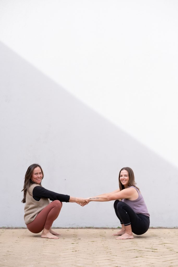 CAT AND ROCHELLE IN A MALASAMA POSE IN THE COURTYARD OF FREMANTLE YOGA CENTRE