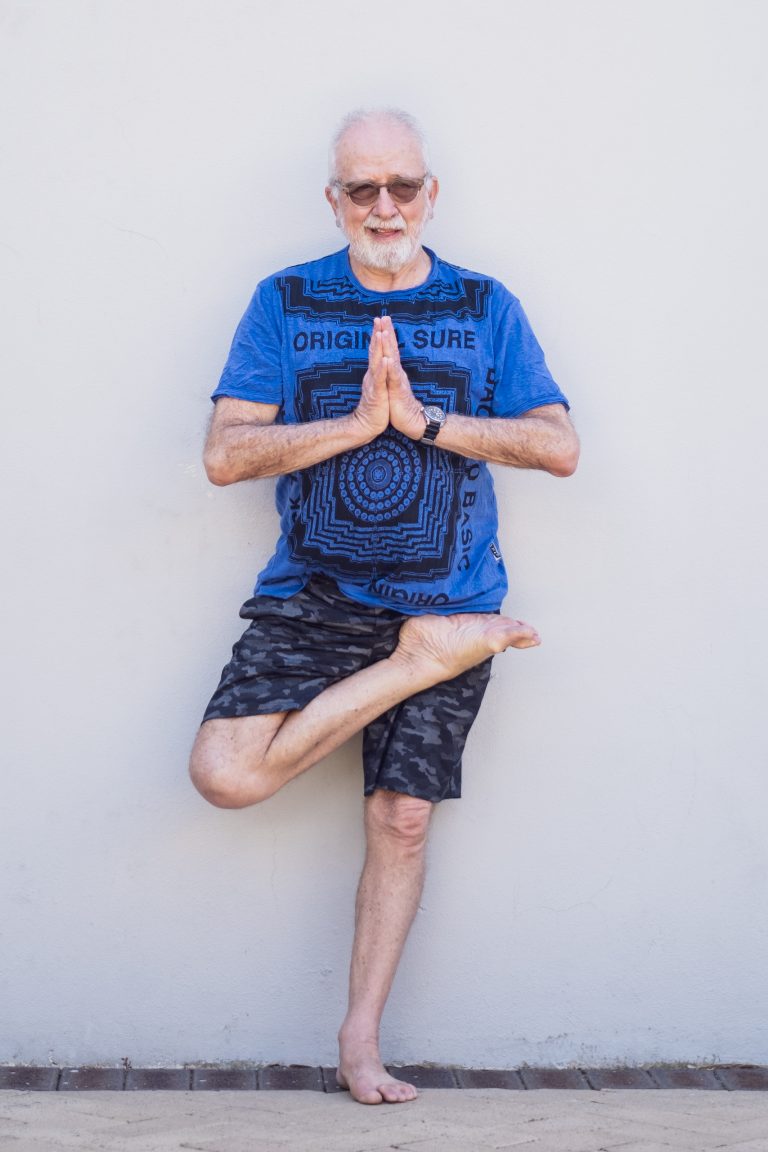 KALE LEAF IN A HALF LOTUS STANDING POSE