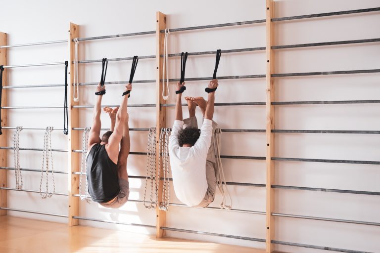 WALT AND JAMES HANGING FROM THE BARS IN THE STUDIO